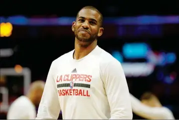  ?? ASSOCIATED PRESS ?? IN THIS MARCH 20 FILE PHOTO, Knicks in Los Angeles. Los Angeles Clippers guard Chris Paul warms up before the team’s game against the New York