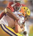  ?? JOHN DAVID MERCER/USA TODAY SPORTS ?? Alabama’s Quinnen Williams wraps up LSU’s Joe Burrow on a sack Saturday.