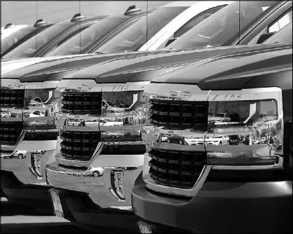  ?? REUTERS ?? New trucks are shown for sale at a Chevrolet dealership in National City, California.