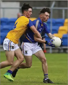  ??  ?? Longford’s Michael McCann swarms all over Wicklow’s Daniel Ging.