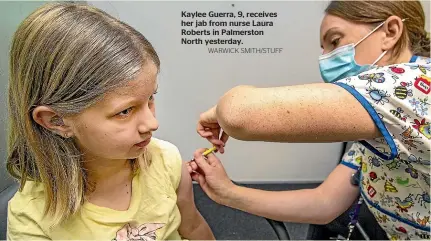 ?? WARWICK SMITH/STUFF ?? Kaylee Guerra, 9, receives her jab from nurse Laura Roberts in Palmerston North yesterday.
