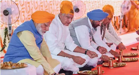  ?? — PTI ?? Prime Minister Narendra Modi eats langar after inaugurati­ng the passenger terminal building of the Kartarpur corridor on the Indian side, also known as Integrated Check Post, in Gurdaspur on Saturday.