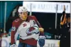  ?? RANDY VAZQUEZ — BAY AREA NEWS GROUP ?? Colorado’s Nathan MacKinnon gets helped off the ice after receiving a hit that resulted in what appears to be a cut on his nose in the third period in San Jose on Wednesday.