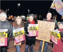  ??  ?? Objection Five objectors make their voices heard at Prestwick Cross in Ayrshire’s answer to a Trump protest