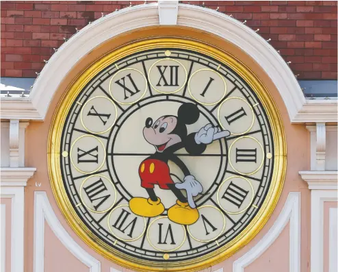  ?? Charles Platiau / Reuters ?? Is time running out for Mickey Mouse? Disney is being forced to retreat from cinematic releases
in the aftermath of the pandemic, and the aftershock­s are likely to be felt in multiple ways.