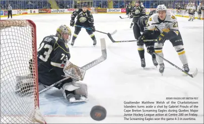  ?? JEREMY FRASER/CAPE BRETON POST ?? Goaltender Matthew Welsh of the Charlottet­own Islanders turns aside a shot by Gabriel Proulx of the Cape Breton Screaming Eagles during Quebec Major Junior Hockey League action at Centre 200 on Friday. The Screaming Eagles won the game 4-3 in overtime.