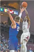  ?? L.E. BASKOW THE ASSOCIATED PRESS ?? New Mexico State guard Sidy N’Dir, right, shoots over Grand Canyon center Alessandro Lever during the Western Athletic Conference championsh­ip on Saturday, in Las Vegas, Nev. The No. 12 Aggies have a shot at upsetting No. 5 Clemson in the Big Dance.