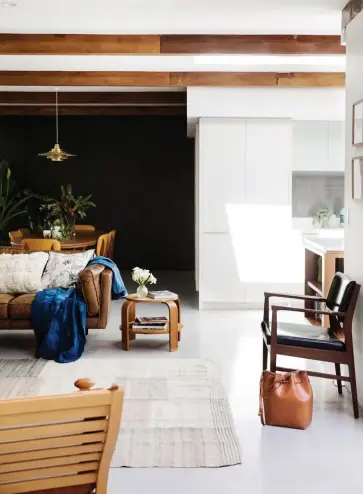  ??  ?? LEFT The dark Dulux Domino paint in the dining area is a gorgeous contrast to the otherwise white walls and creates a sense of intimacy in this space. The Nova pendant lightwas designed in the 60s by Jo Hammerborg for Fog & Mørup. OPPOSITE In keeping...