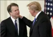  ?? EVAN VUCCI — THE ASSOCIATED PRESS ?? President Donald Trump greets Judge Brett Kavanaugh his Supreme Court nominee, in the East Room of the White House, Monday, July 9, 2018, in Washington.