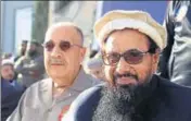  ?? TWITTER ?? Palestine’s ambassador to Pakistan Walid Abu Ali (left) on the dais with Hafiz Saeed in this photo shared on social media.