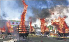  ?? ANI ?? Forest department officials burn Rhino horns at Bokakhat stadium in Golaghat on Wednesday.