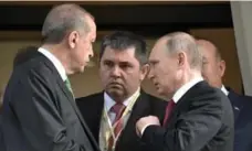  ?? ALEXEI NIKOLSKY/SPUTNIK, KREMLIN POOL PHOTO ?? Turkish President Recep Tayyip Erdogan, left, speaks to Russian President Vladimir Putin as he leaves after their meeting in Sochi on Wednesday.