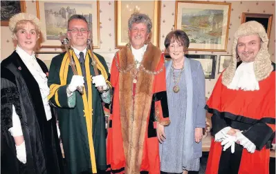  ??  ?? ● Councillor Ioan Thomas has been installed as Mayor of the Royal Town of Caernarfon for the fourth time. Pictured at the ceremony are, from left, Town Clerk Kathryn Owen, Mace Bearer Alwyn Jones, Ioan Thomas, Mayoress Sian Thomas and Town Recorder...