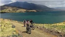  ??  ?? Cyclists enjoy the new section of track from Sailors Cutting to Benmore Dam.