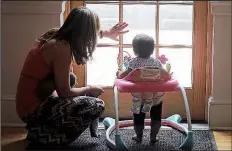  ?? P/RICK BOWMER ?? Within the wallsof Salt Lake City’s First Unitarian Church, Honduran Vicky Chavez plays with her daughter Issabella. Chavez says seeing fellow Central Americans separated from their children at the U.S.-Mexico border makes her intent on trying to fight to stay in the United States where her entire family lives.