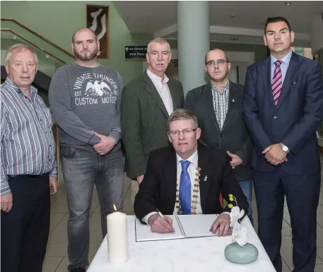  ??  ?? Book of Condolence opened at County Hall for the victims of the Manchester attack Cllr Seamus Kilgallon, Cllr Gino O’Boyle, Cllr Declan Bree, Cllr Cris McManus, Cllr Tom McSharry and Cllr Hubert Keaney. Inset above: Armed police patrol streets outside...