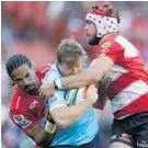  ?? Photo / AP ?? The Lions put the squeeze on the Waratahs in their semifinal.