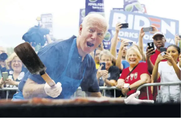  ?? (Photo: AP) ?? In this September 21, 2019 file photo, Joe Biden works the grill during the Polk County Democrats Steak Fry in Des Moines, Iowa. President Joe Biden spent only a weekend as the “Hamburglar” in the conservati­ve media world, but the incident illustrate­d the speed at which a false and damaging story can spread. The Daily Mail wrote about things that could potentiall­y be in a Biden climate change plan, and cited an academic study that mentioned reductions in greenhouse gases that could be achieved with limits on beef consumptio­n.