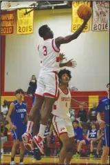  ?? MEGAN WIDICK Special to the Valley Press ?? Paraclete’s Mister Burnside (3) goes up for a layup against Littlerock during Tuesday’s season opener at Paraclete High School. Burnside scored 13 points in the Spirits’ 64-49 victory.