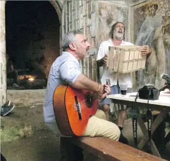  ??  ?? Art restorer Tonio Creanza and storytelle­r Donato Emar Orante perform in the documentar­y Shepherds in the Cave, which screens Sunday as part of the Italian Film Festival at the VIFF Vancity Theatre.