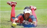  ?? [PHOTO BY SARAH PHIPPS, THE
OKLAHOMAN] ?? The U.S. national team came up just short of Japan in the championsh­ip game of the World Cup of Softball on Sunday, but players like Michelle Moultrie are quickly becoming household names.