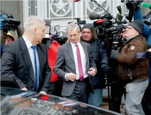  ?? AP ?? British Ambassador to Russia, Laurie Bristow (centre), leaves after a meeting at the Russian foreign ministry in Moscow on Tuesday. —