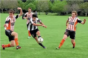  ??  ?? Matamata Swifts’ Luis John fires off a shot against Napier club, Port Hill United.