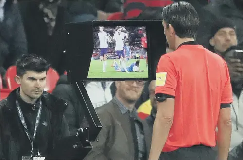  ?? PICTURE: ADAM DAVY/PA WIRE ?? SCREEN TEST: Referee Deniz Aytekin consults VAR before awarding Italy a late penalty at Wembley that enabled them to draw 1-1 with England.