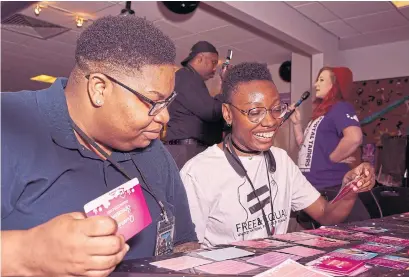  ?? MERON TEKIE MENGHISTAB THE NEW YORK TIMES ?? Attendees play “Queering Spacetime” by Joyce Lin, at the Game Developers of Color Expo at the Schomburg Center in New York.