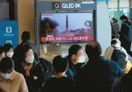  ?? AHN YOUNG-JOON/AP ?? A television screen shows a file image of a North Korean missile launch during a news program broadcast Friday at the Seoul Railway Station in Seoul, South Korea.