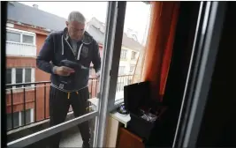  ?? VALENTINA PETROVA — THE ASSOCIATED PRESS ?? Nikolay Belev, a self-employed constructi­on worker, works at a client's home in Sofia, Bulgaria, on Monday. Belev's income is not keeping pace with gas and oil prices.