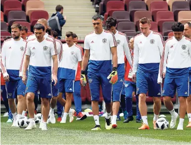  ?? AP PHOTOS ?? Russian team during a training session on the eve of FIFA World Cup opener.