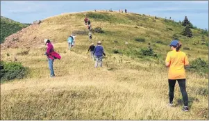  ?? SUBMITTED PHOTO/JENNY SYMES, HIKE THE HIGHLANDS ?? The Hikes the Highlands Festival will take place Sept. 8-17 in northern Cape Breton. More than 100 hikers are expected to attend this year’s festival. Shown are hikers on top of Meat Cove Mountain during the September 2016 festival.