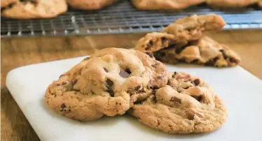  ?? GRETCHEN MCKAY/ PITTSBURGH POST-GAZETTE ?? Butterscot­ch pudding mix is the secret weapon in these ooeygooey cookies studded with chocolate chips and toasted pecans. The mix — made largely of cornstarch — helps create a thicker cookie because it prevents the batter from spreading.