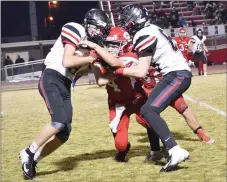  ??  ?? Freshman Blackhawk Trevor Blair (No. 8) running after catching a pass from quarterbac­k Carson Rhine was protected by Blackhawk Brayden Ralph (No. 88) as a Tiger defender tried to stop him. Blair was Rhine’s top receiver, catching two for 71 yards.