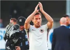  ?? AP ?? Roma’s Francesco Totti waves to supporters at the end of the Serie A match against Chievo last week.