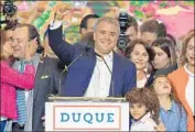  ?? Raul Arboleda AFP/Getty Images ?? PRESIDENT-ELECT Ivan Duque celebrates with his family and supporters in Bogota, Colombia.