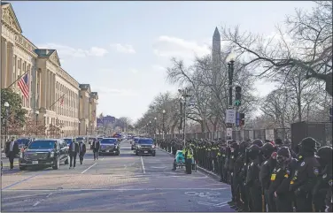  ?? (AP/Evan Vucci) ?? The presidenti­al motorcade drives during Inaugurati­on Day ceremonies Wednesday in Washington. On Friday, The Associated Press reported on stories circulatin­g online incorrectl­y claiming troops in Washington turned their backs on President Joe Biden’s motorcade as it passed on its way to his inaugurati­on at the U.S. Capitol.