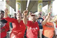  ??  ?? Women raise their fists as they chant slogans calling for the release of the remaining 112 out of 219 kidnapped Chibok schoolgirl­s ahead of the fourth anniversar­y of their snatching during a vigil in Lagos.