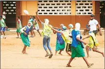  ??  ?? Students at Kanda Cluster of Schools, participat­e in a rugby training session in Accra, Ghana on Dec 13, 2017. (AFP)