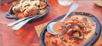  ?? AP PHOTO ?? Baked brussels sprouts and grilled octopus (right), at Finca Altozano in Valle de Guadalupe in Ensenada Municipali­ty, Baja California, Mexico.