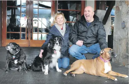  ?? NICK PROCAYLO/ ?? Annette Poitras and husband Marcel with, from left, Bubba, Chloe and Roxy on Sunday. They credit the dogs with helping to save Annette’s life when she became lost on Coquitlam’s Burke Mountain in November.