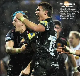  ??  ?? WINNING IN THE RAIN: Gareth Steenson (far left) and Henry Slade lead the Exeter Chiefs’ celebratio­ns