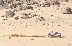  ?? AFP ?? Nasser Al-Attiyah and his co-driver Mathieu Baumel compete during Stage 1B of the Dakar Rally 2022 around the Saudi city of Ha’il on Sunday.