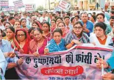  ?? PTI ?? Madhya Pradesh Mahila Congress workers take part in a candle march in Bhopal yesterday in protest against the rape of an eight-year-old girl in Mandsaur.