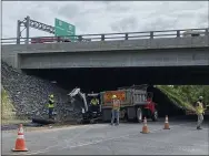  ?? HOLLY HERMAN — READING EAGLE ?? Crews with JD Eckman, Atglen, Chester County, are working under the Betzwood Bridge, West Norriton, Monday, as part of a $96.5million upgrade on Route 422. They are required to avoid an area where peregrine falcons are nesting.