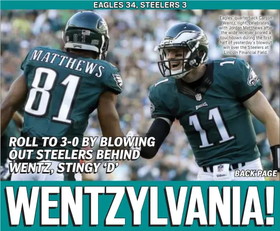  ?? ASSOCIATED PRESS ?? Eagles’ quarterbac­k Carson Wentz, right, celebrates with Jordan Matthews after the wide receiver scored a touchdown during the first half of yesterday’s blowout win over the Steelers at Lincoln Financial Field.