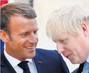  ??  ?? Emmanuel Macron with Boris Johnson after their meeting at the Elysee Palace in Paris yesterday