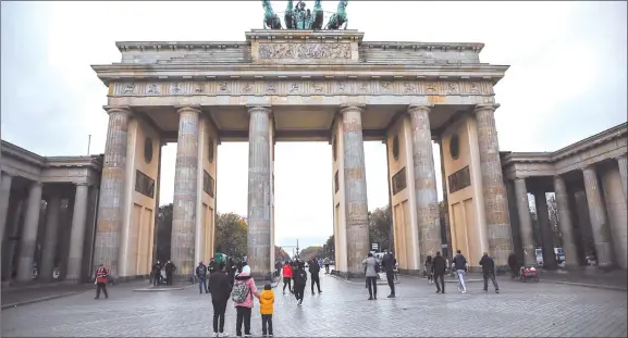  ?? Photo: Nampa/AFP ?? Shut down… People are seen in front of the Brandenbur­g Gate in Berlin on a cloudy 1 November 2020 amid the coronaviru­s pandemic.