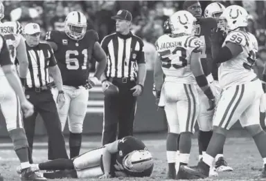  ??  ?? Raiders quarterbac­k Derek Carr lies on the field after breaking his leg Saturday.